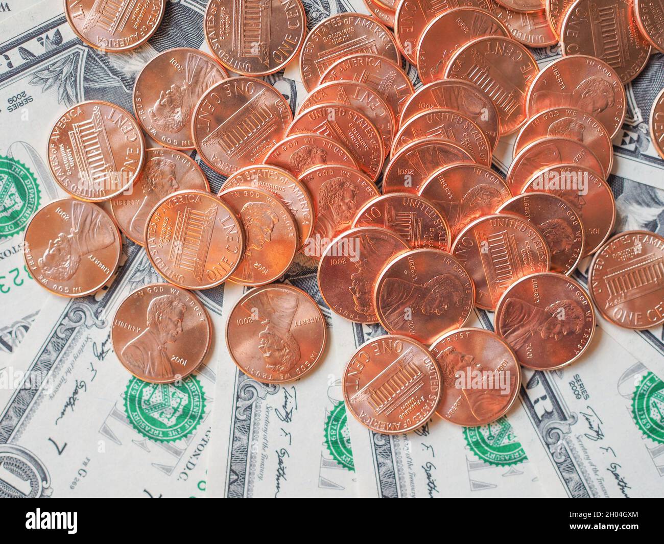 Dollar coins and banknotes currency of the United States useful as a background. Stock Photo