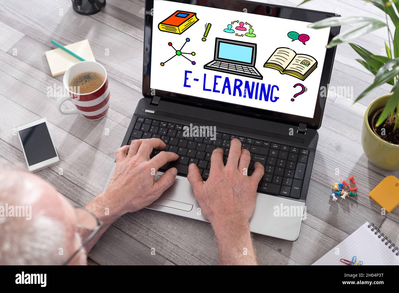 Laptop Displaying Elearning E-learning concept shown on a laptop used by a man Stock Photo - Alamy