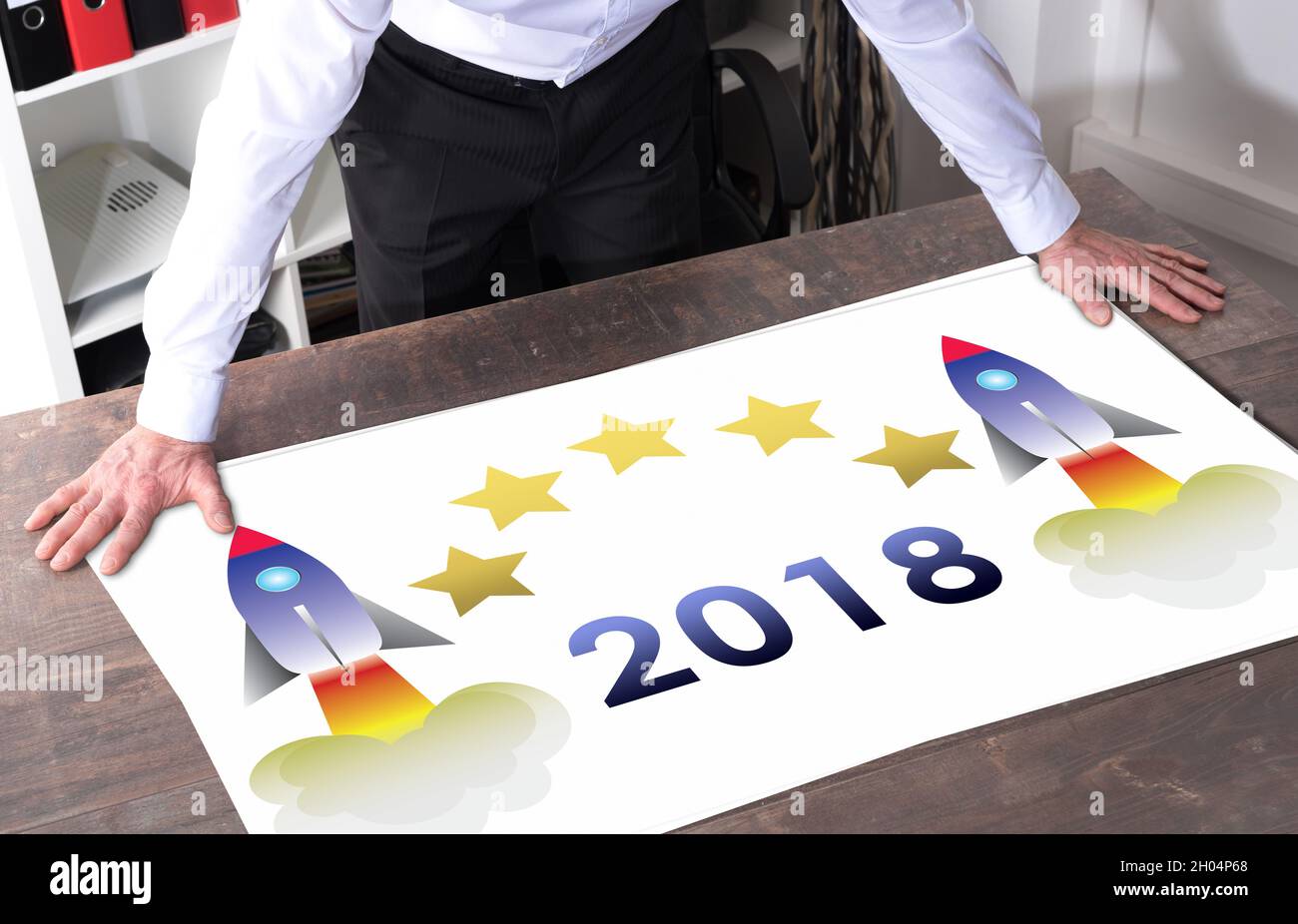 Man watching a new year 2018 concept placed on a desk Stock Photo