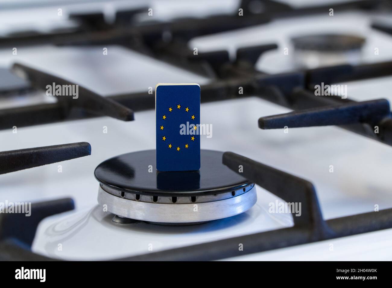 Shortage and gas crisis. Flag of the European Union on the switched off gas stove Stock Photo