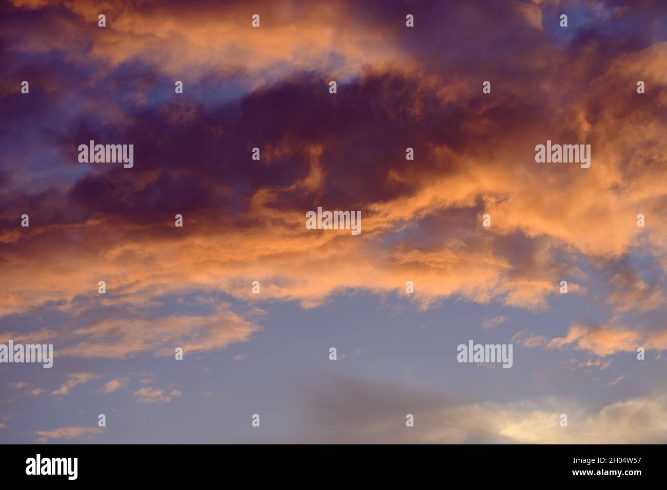 Sunset sky with orange clouds. Nature background Stock Photo - Alamy