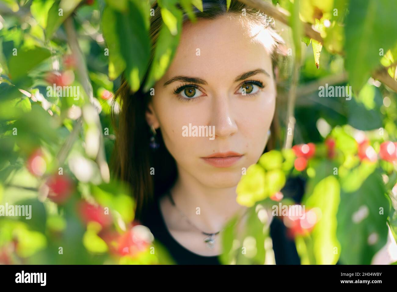 Portrait of beautiful young woman in the park Stock Photo - Alamy