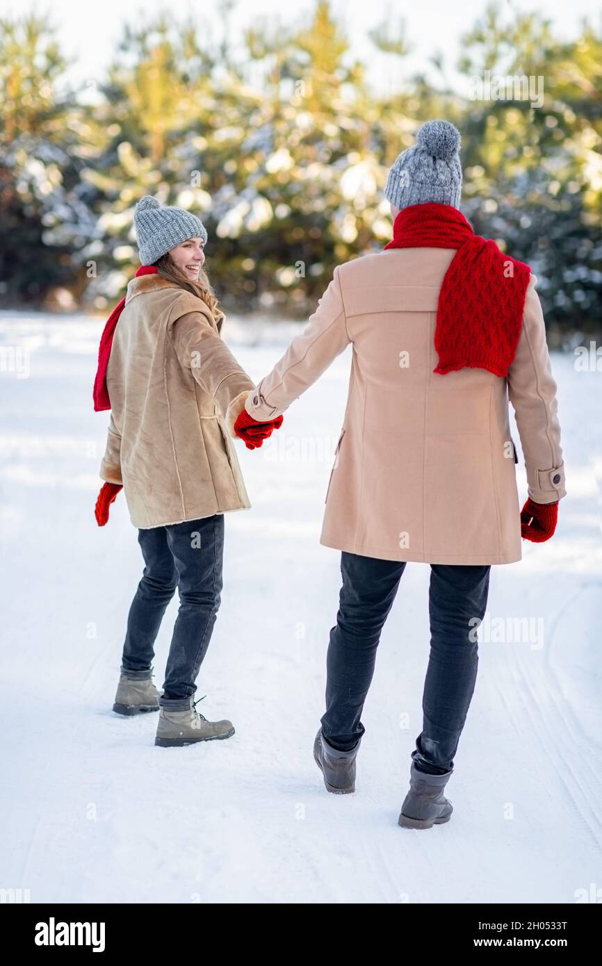 Romantic couple snow rear view hi-res stock photography and images - Alamy