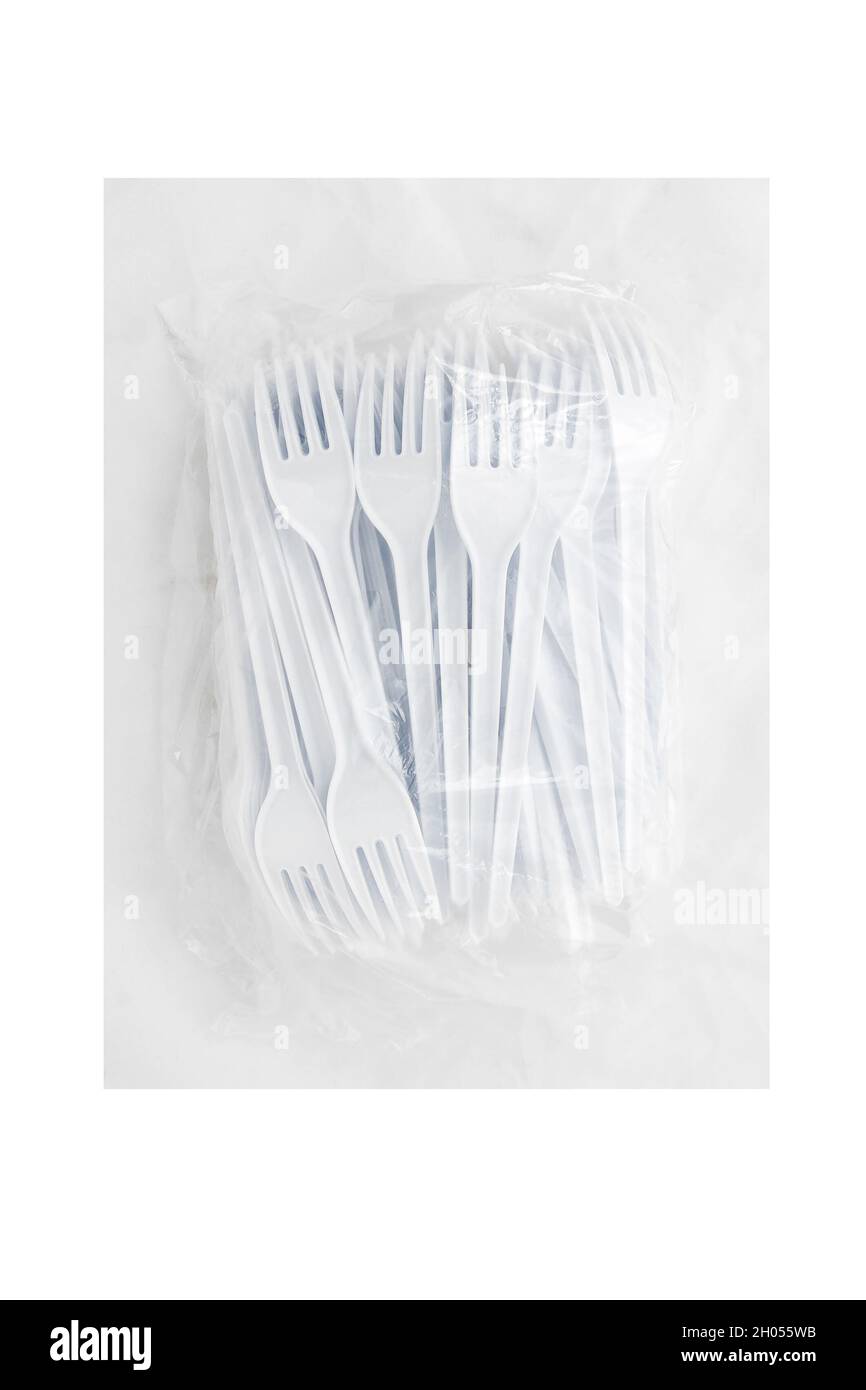 Packaging of disposable plastic forks isolated on white background ...
