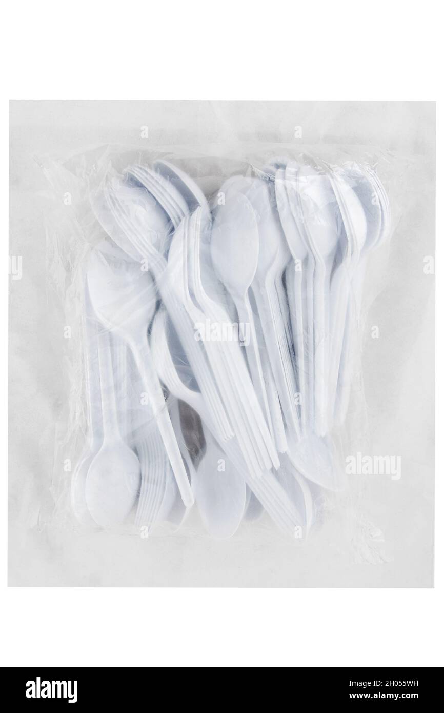 Packaging of disposable plastic spoons isolated on white background