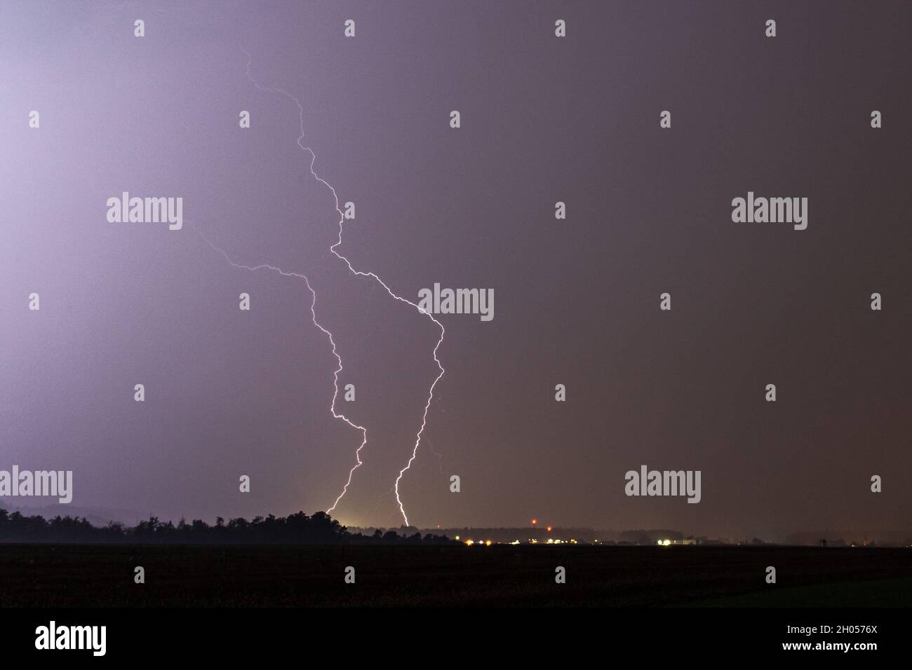 Lightning Strike at dark stormy and rainy night Stock Photo - Alamy