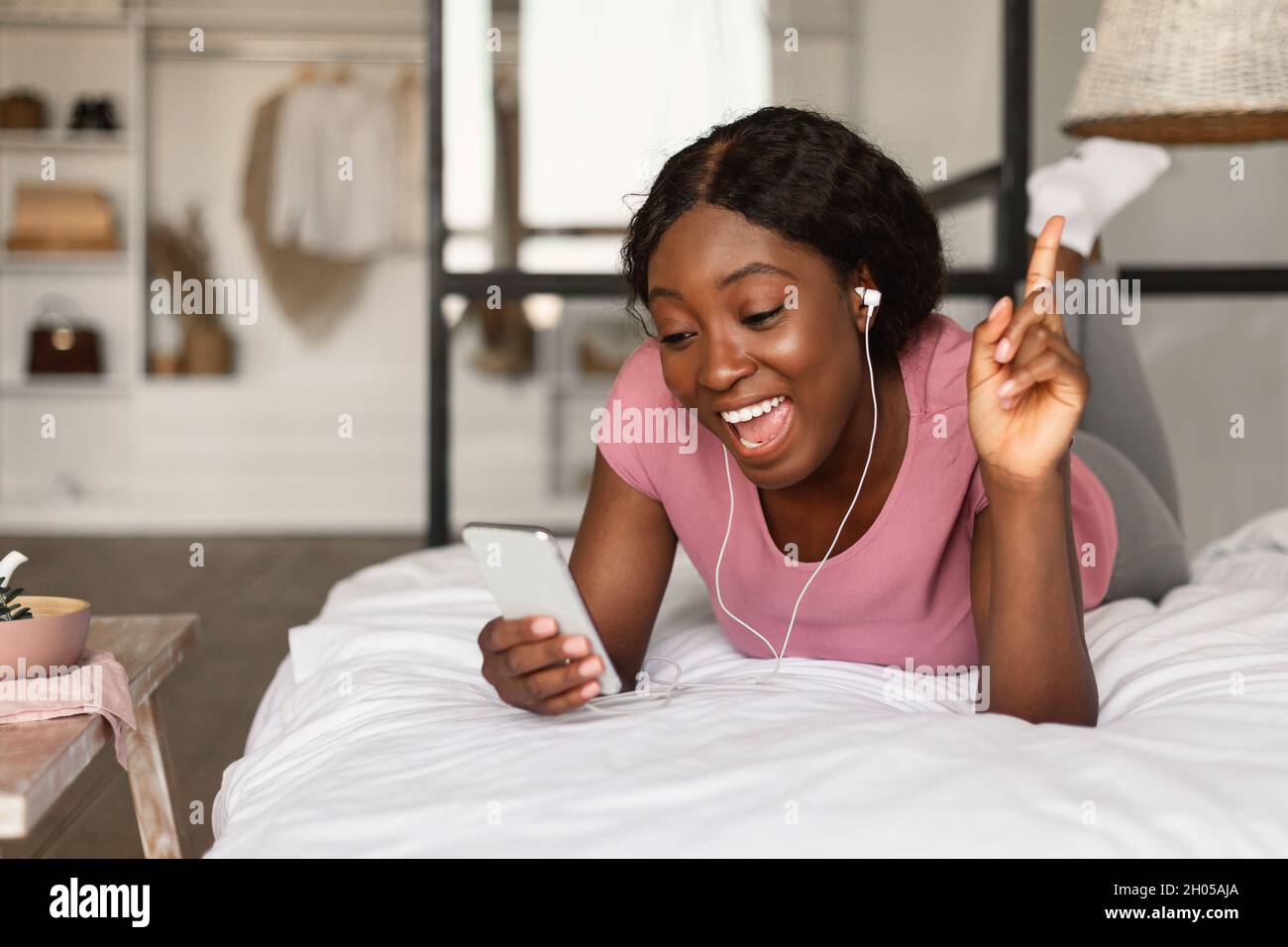 Young female singing bed hi-res stock photography and images - Alamy