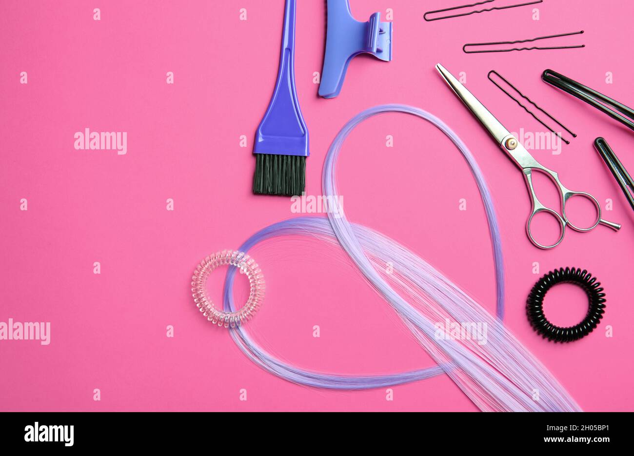 Flat lay composition with hair salon tools on color background Stock