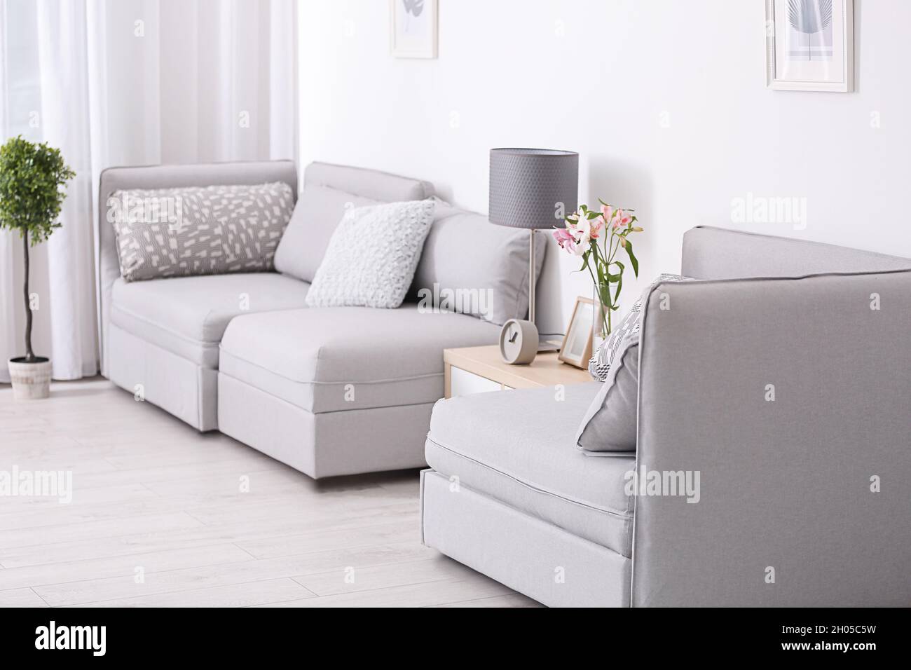 Stylish living room interior with sectional sofa Stock Photo Alamy