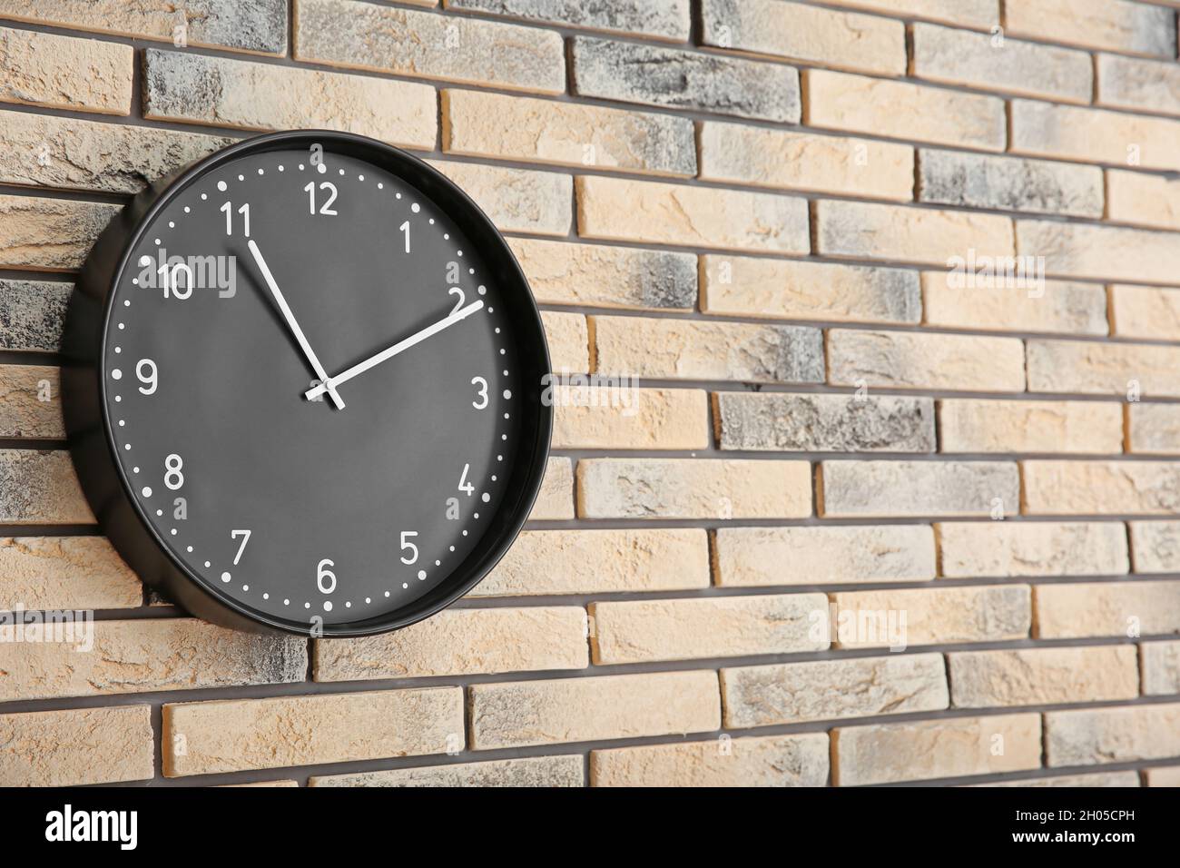 Stylish clock on brick wall. Time concept Stock Photo Alamy