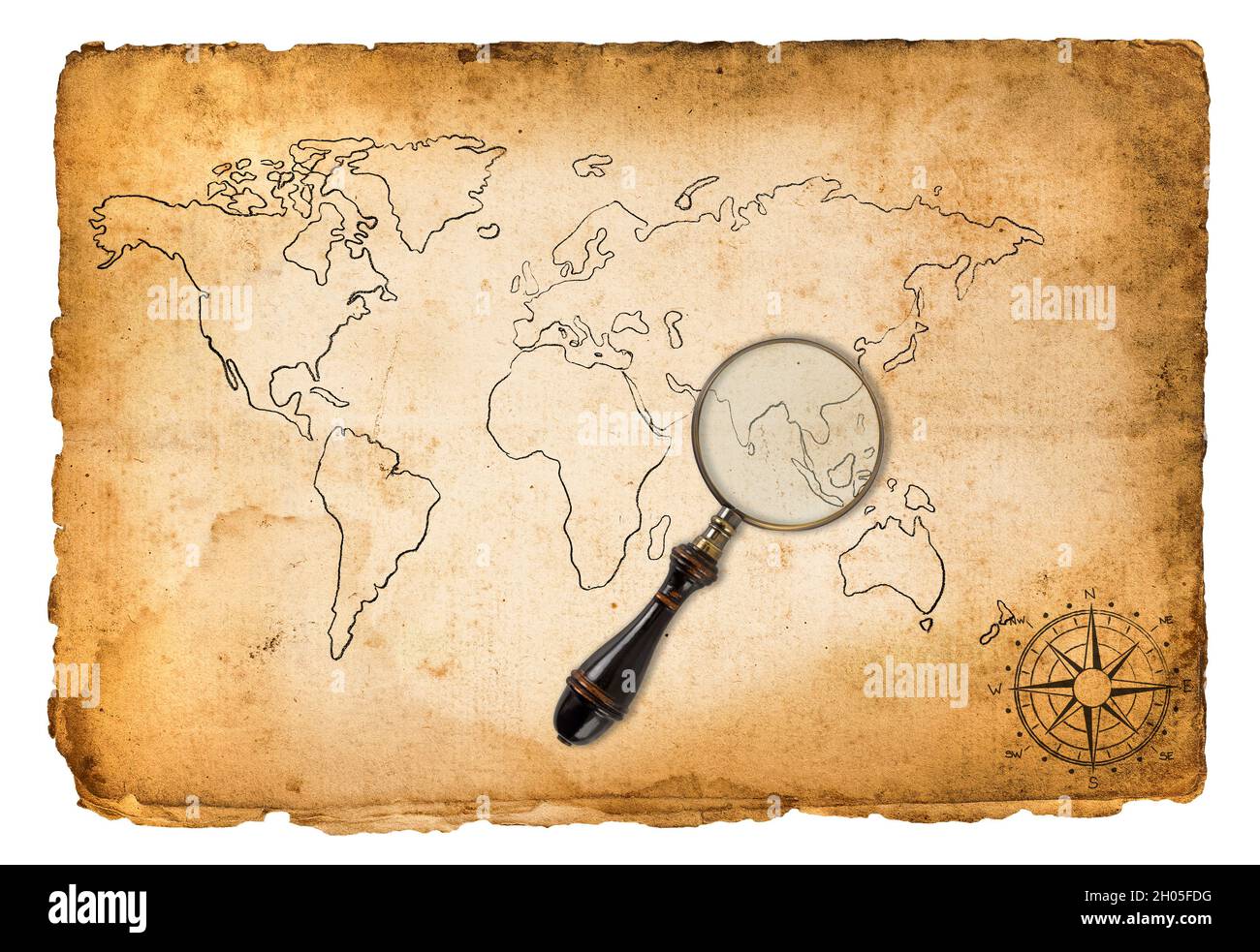 Old map with wind rose and magnifying glass isolated on white Stock Photo