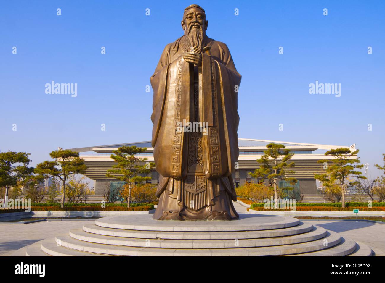 Confucius, ancient  Chinese philosopher - his statue rising outside modern Confucius Museum, Qufu, Shandong, China Stock Photo