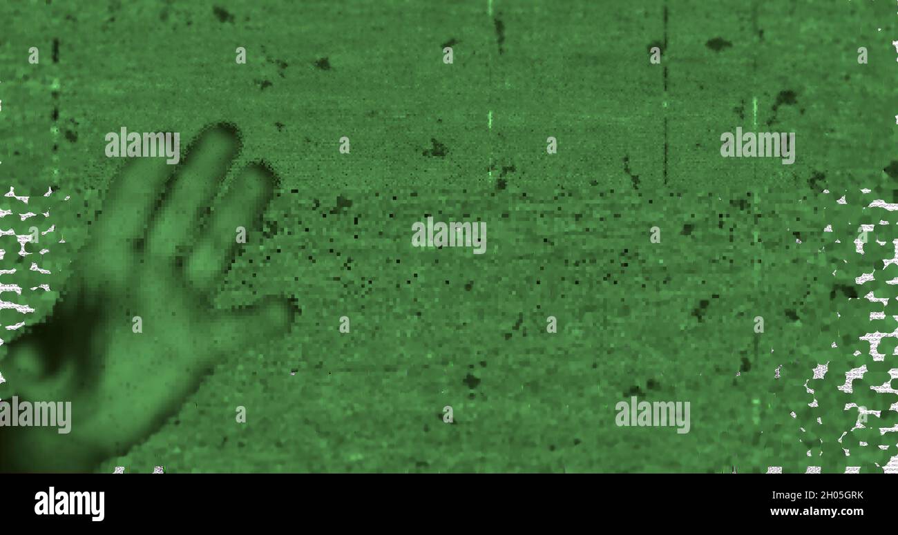 Image of scary halloween pattern with screen noises over open hand ...