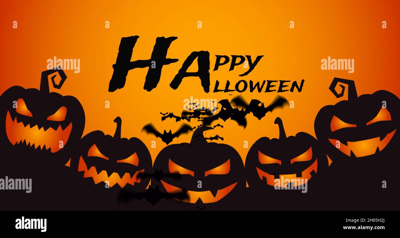 Image of halloween greetings adn bats over jack o lantern on orange background Stock Photo