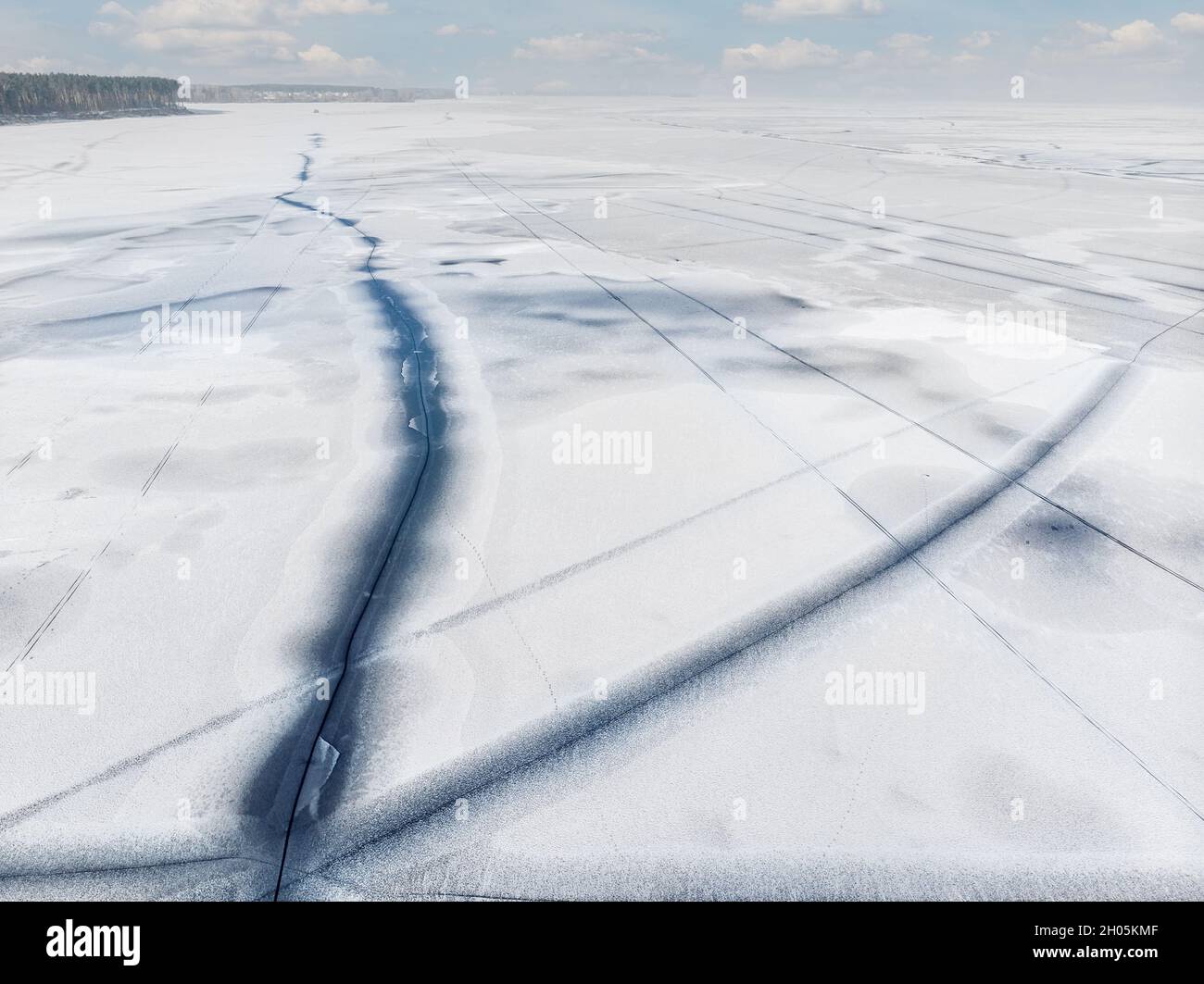 Flying above frozen lake cracked hi-res stock photography and images ...