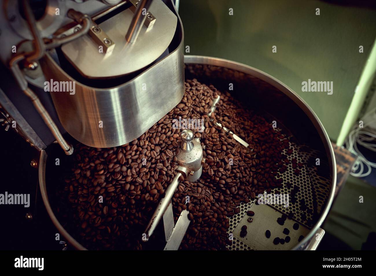 Fresh organic coffee being roasted in machine Stock Photo