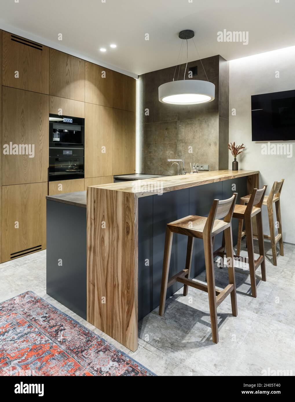 Modern minimalist kitchen interior with natural veneer wooden furniture