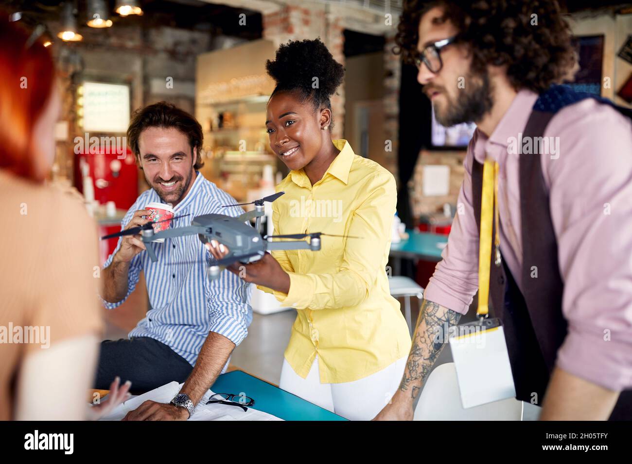 Young colleagues collaborating on a projecting the drone together Stock Photo