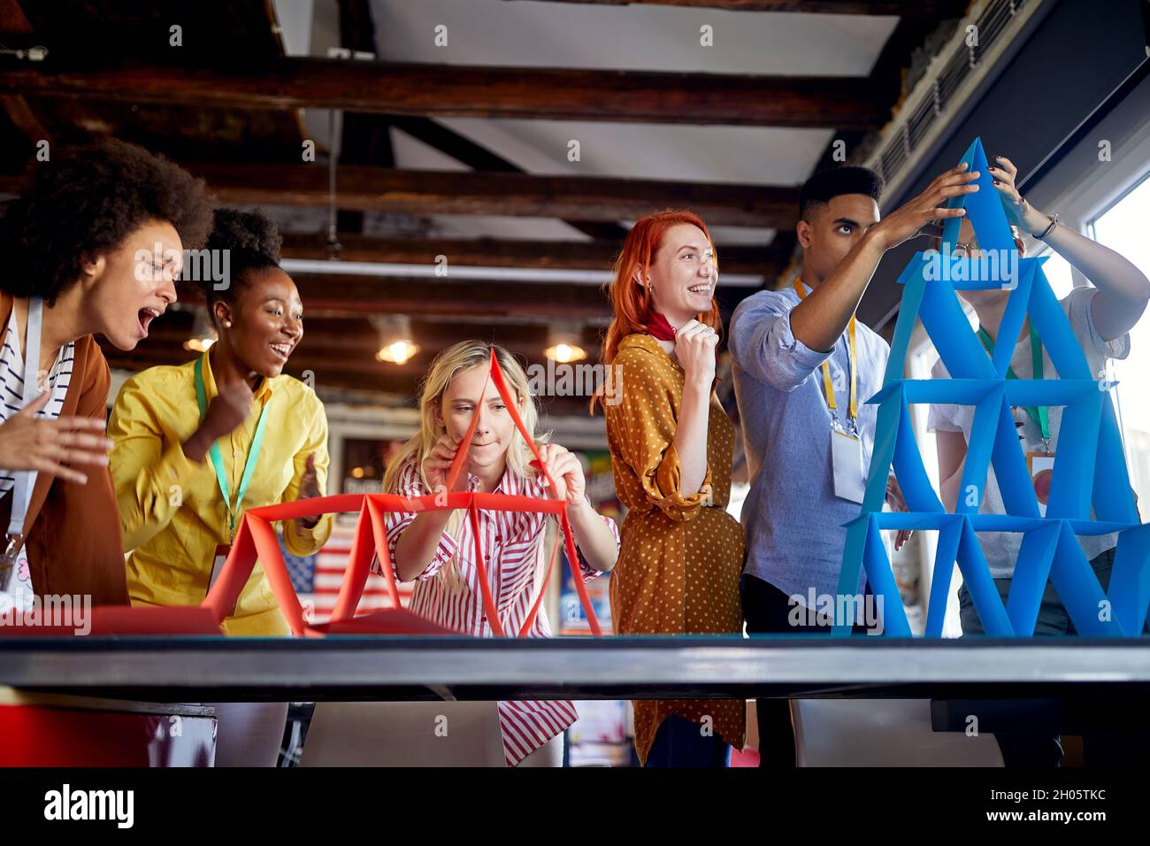 Group of work colleagues having fun competition together at the office