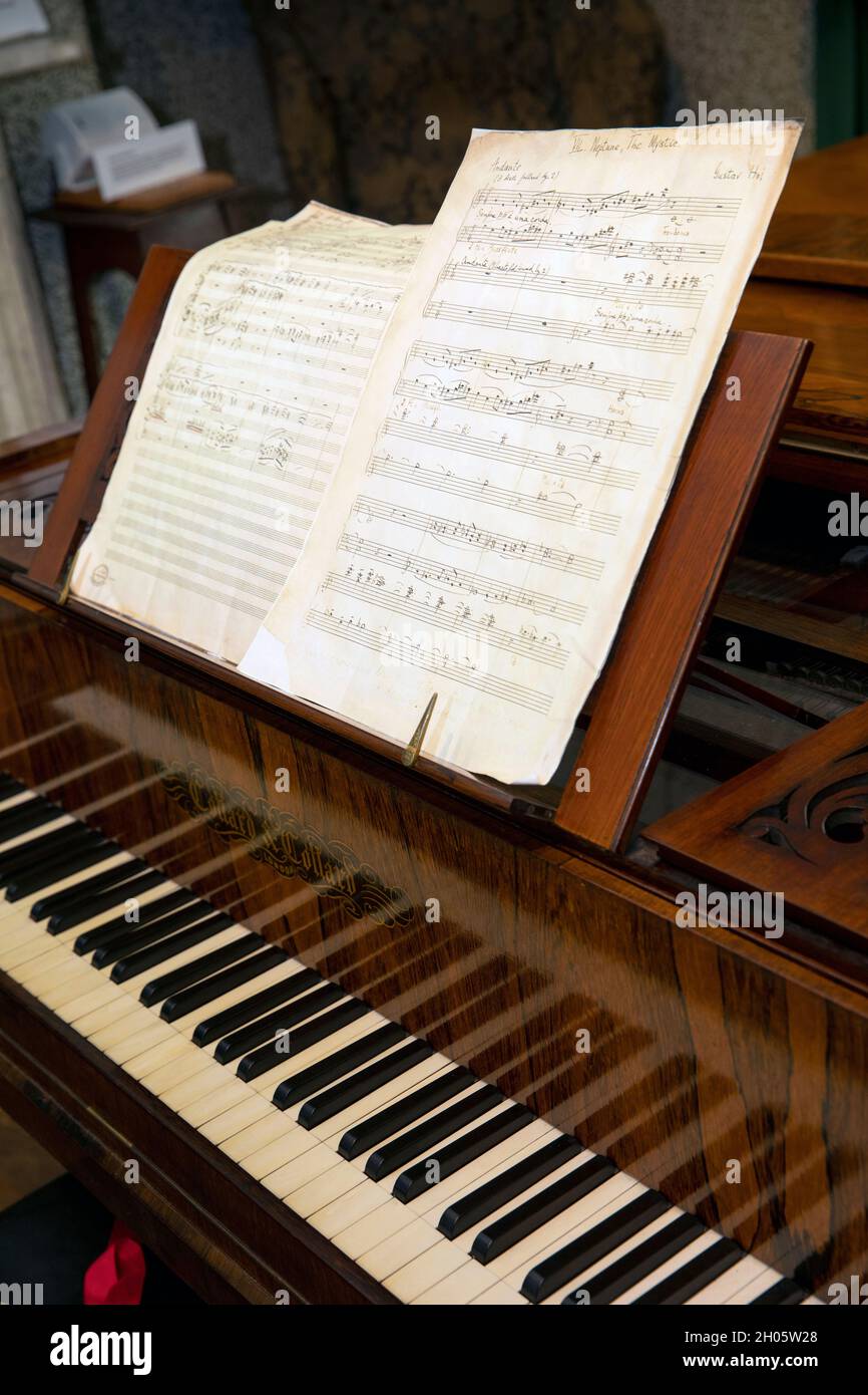 UK, Gloucestershire, Cheltenham, Clarence Road, Holst Birthplace Museum, Gustav Holst’s piano with Planet Suite music Stock Photo