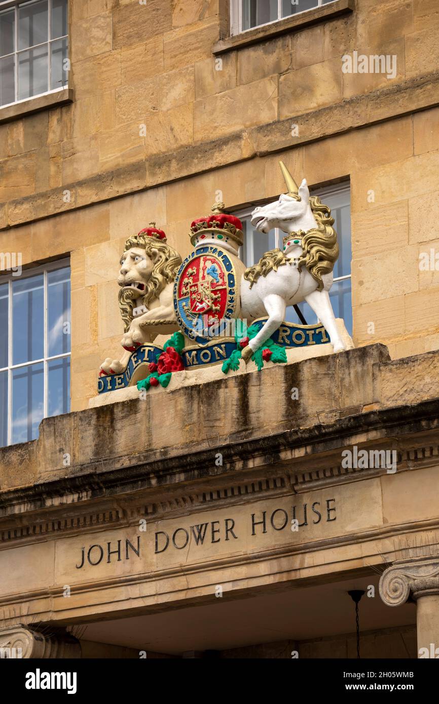 UK, Gloucestershire, Cheltenham, Crescent Place, royal arms above entrance portico of 1812 John Dower House, former hotel and Police Station Stock Photo