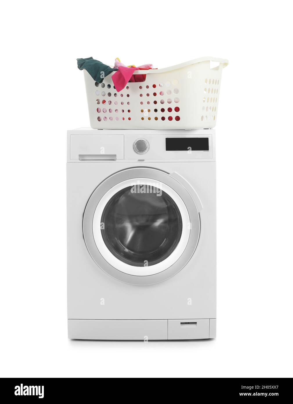 Modern washing machine and basket with laundry on white background ...