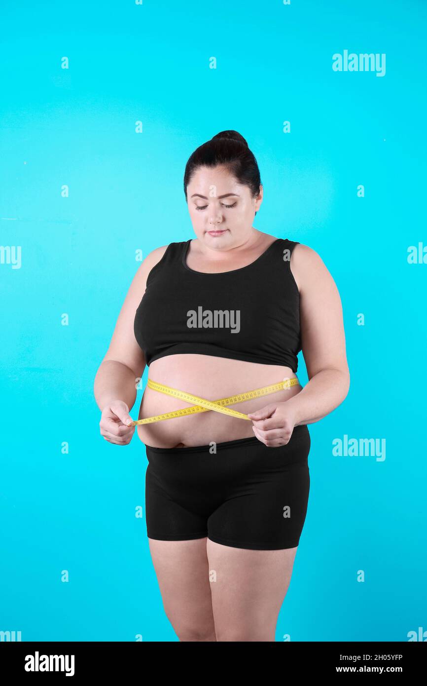 Overweight Woman With Tape Measure Around Waist. Woman Belly Fat Overweight  Stock Photo, Picture and Royalty Free Image. Image 92769926.