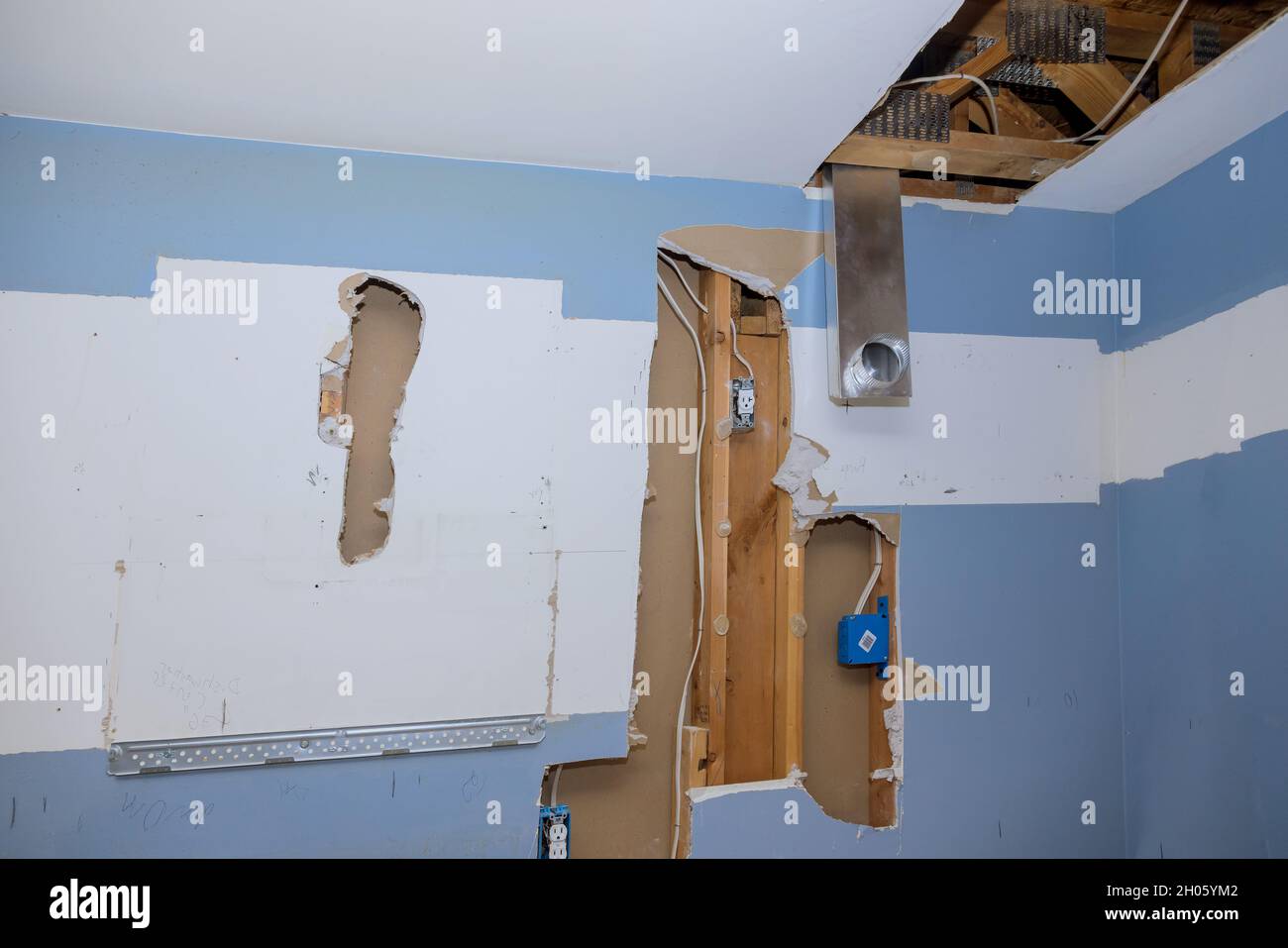 Construction home the install of HVAC vent hose duct pipes in ceiling