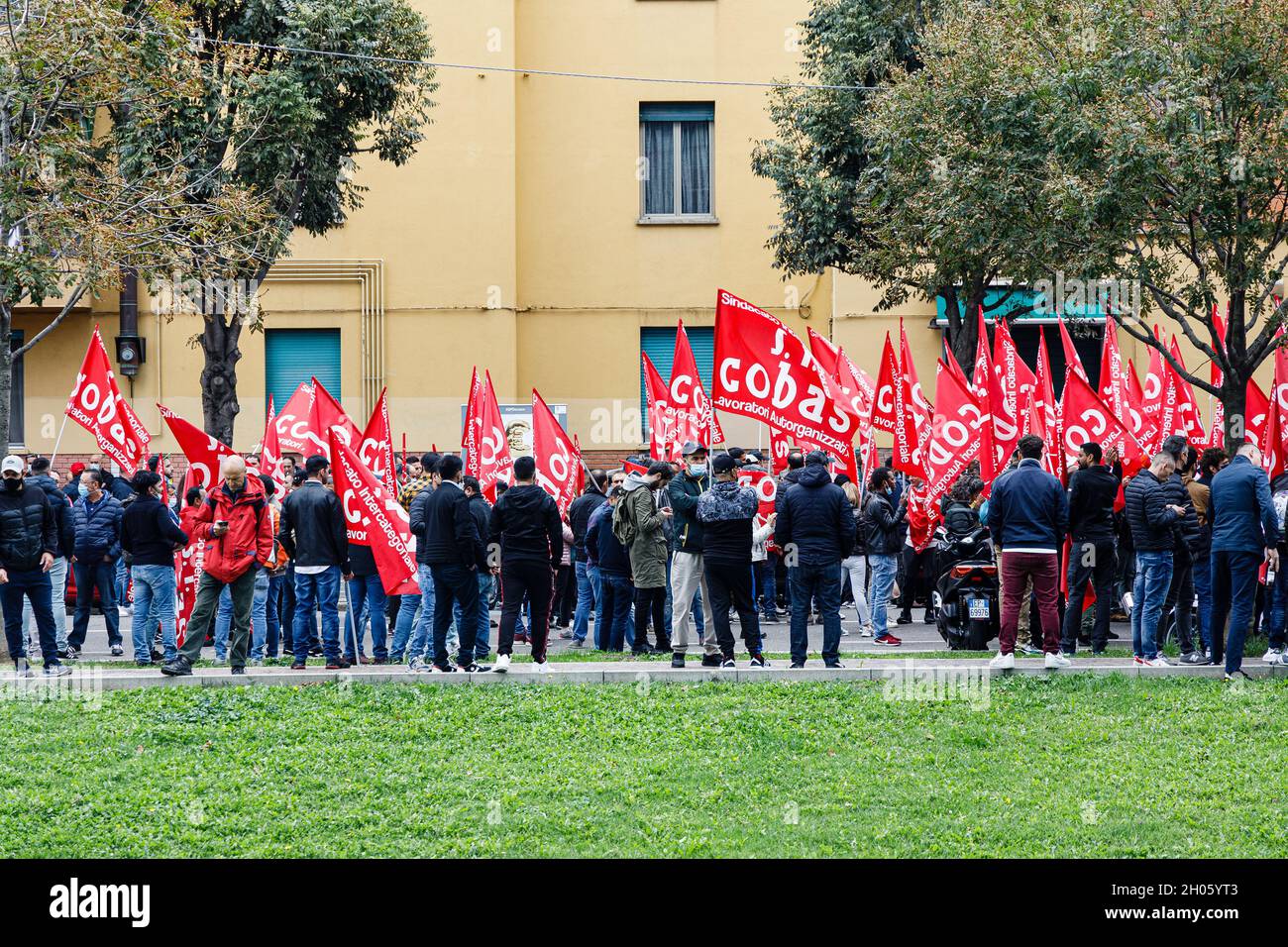 Bologna, Italy. 11th Oct, 2021. Protesters hold a COBAS flag during a  general strike called by the grassroots trade unions (Cobas, Cub, Usb)  against the Draghi government. The protest was attended by