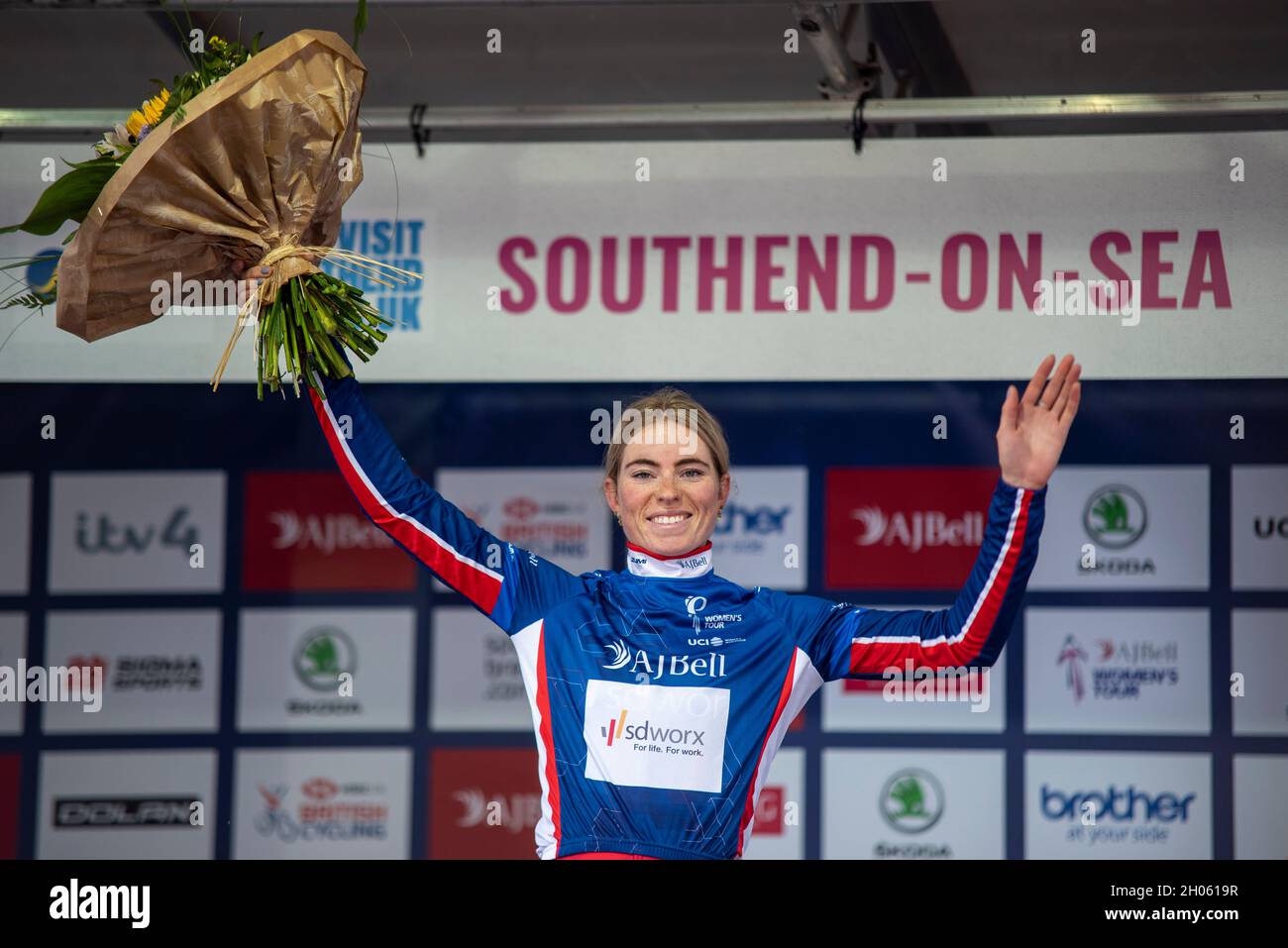 Demi Vollering, cyclist with Team SD Worx celebrating leading the AJ