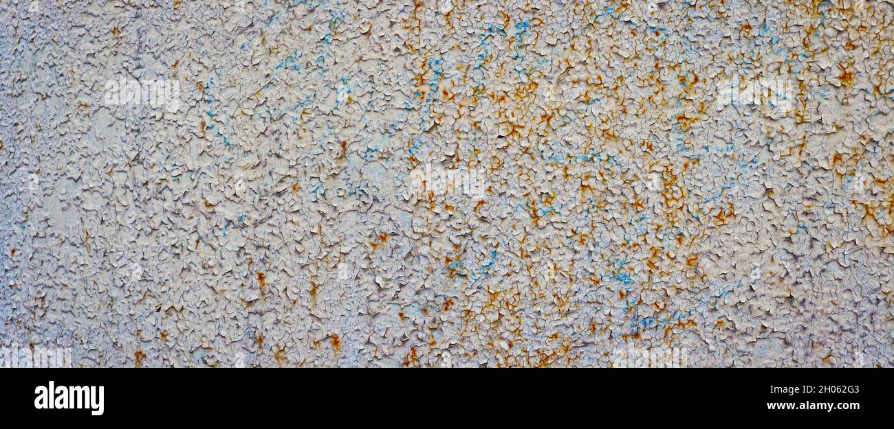 Old rusty metal surface with peeling paint. Stock Photo