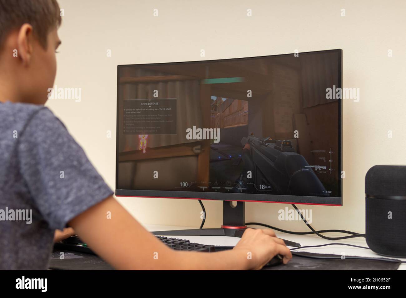 Valorant is a free-to-play first-person hero online shooter. Video computer  game. Man play video game on laptop Stock Photo - Alamy