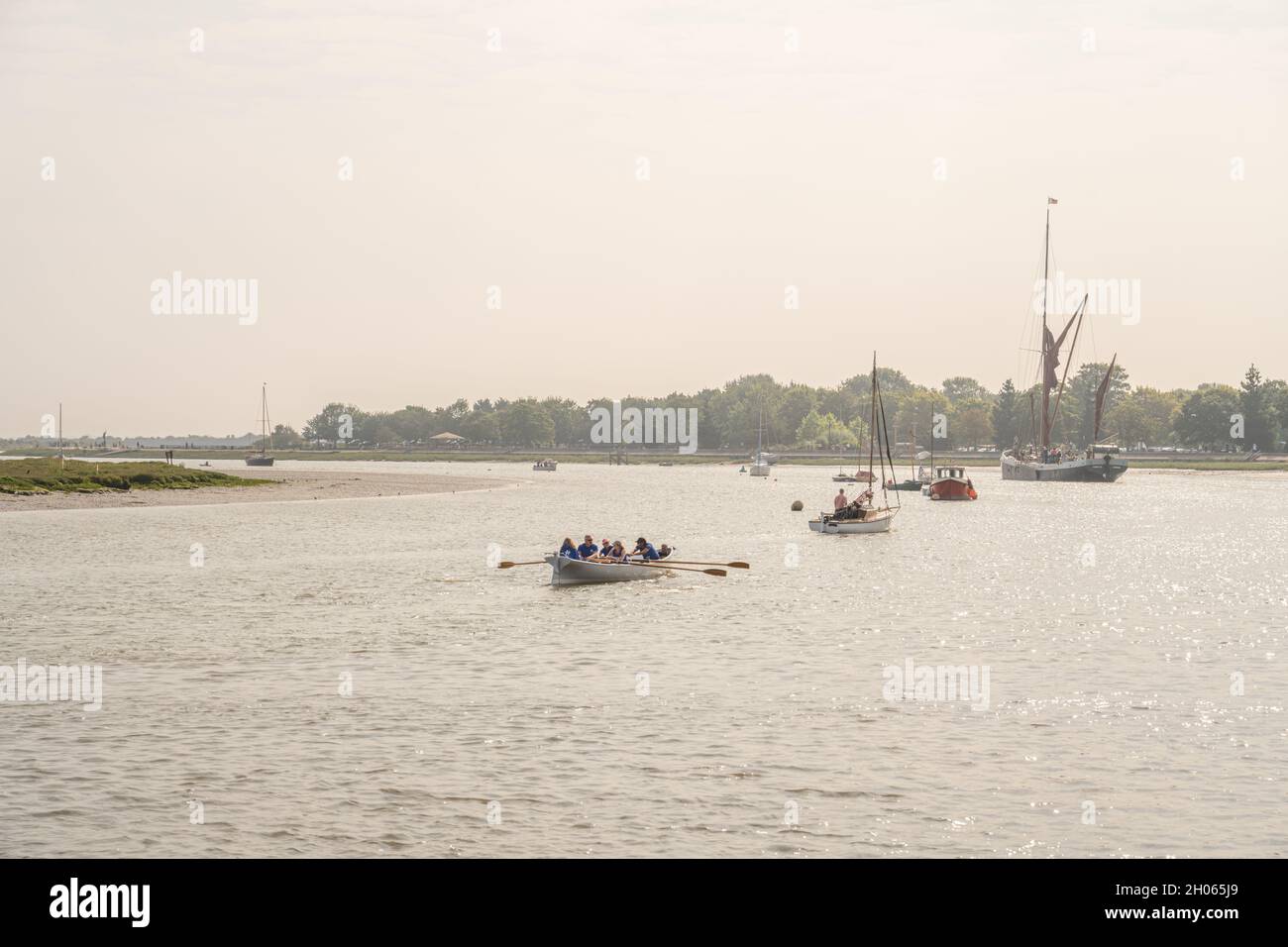 Thames barge Thistle on the river Chelmer at Maldon Essex. With rowing skiff in foreground. Stock Photo