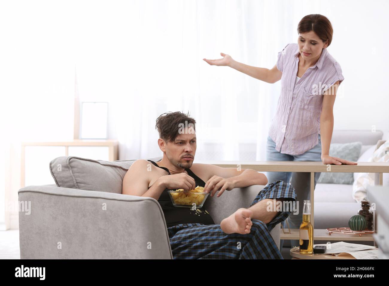 lazy-husband-quarrelling-with-hardworking-wife-at-home-stock-photo-alamy