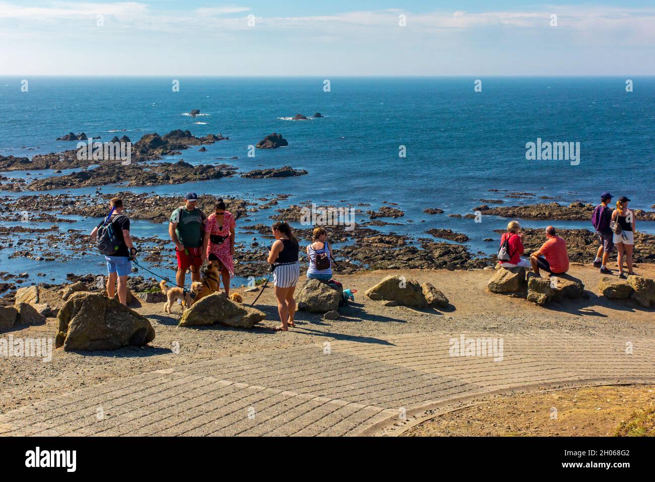 Tourists in summer at Lizard Point on the south coast of Cornwall England UK Stock Photo