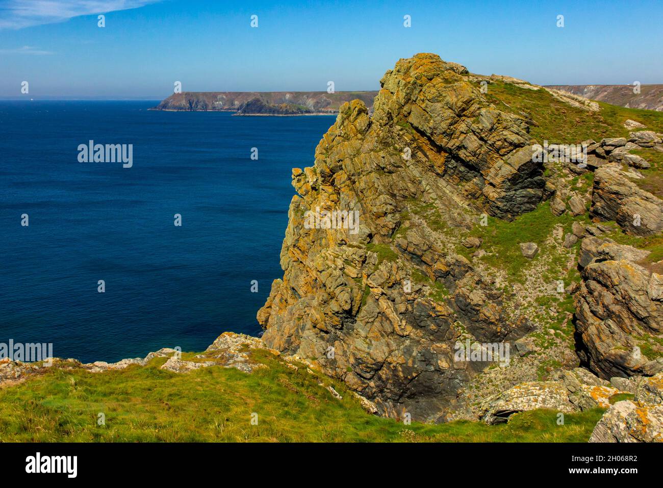 Rocky cliffs near Lizard Point on the South West Coat Path in south Cornwall England UK Stock Photo