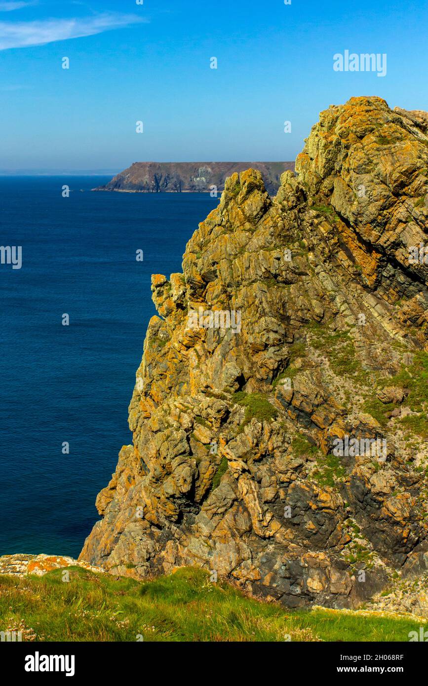 Rocky cliffs near Lizard Point on the South West Coat Path in south Cornwall England UK Stock Photo