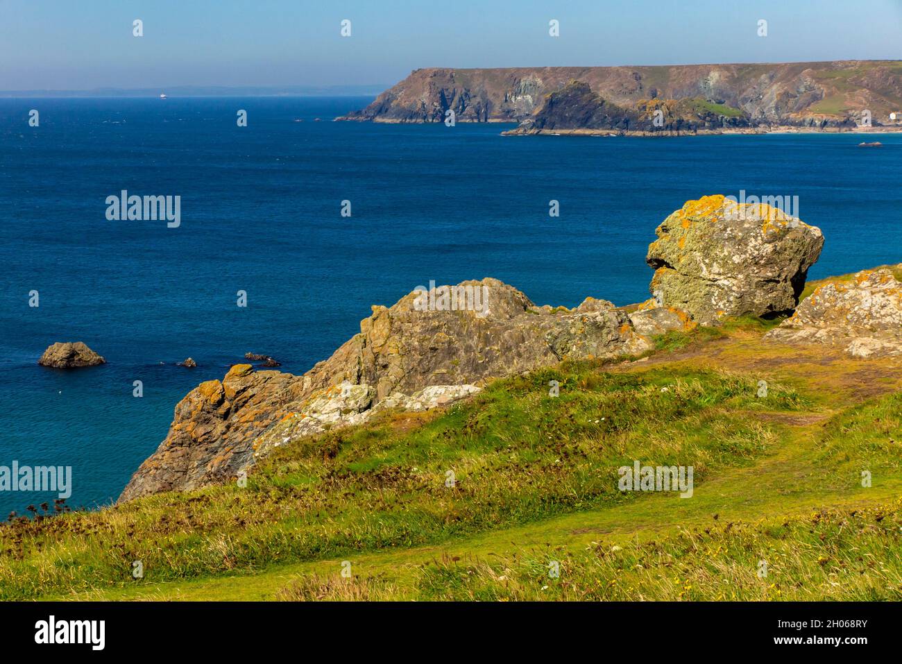 Rocky cliffs near Lizard Point on the South West Coat Path in south Cornwall England UK Stock Photo