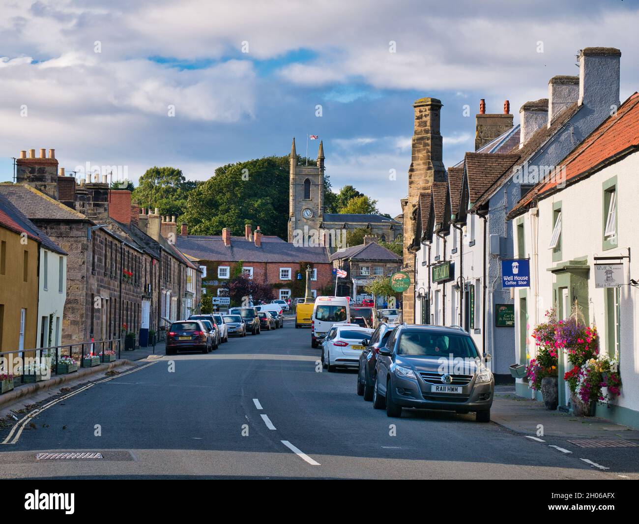 Sandstone buildings and the busy high street and church in the centre