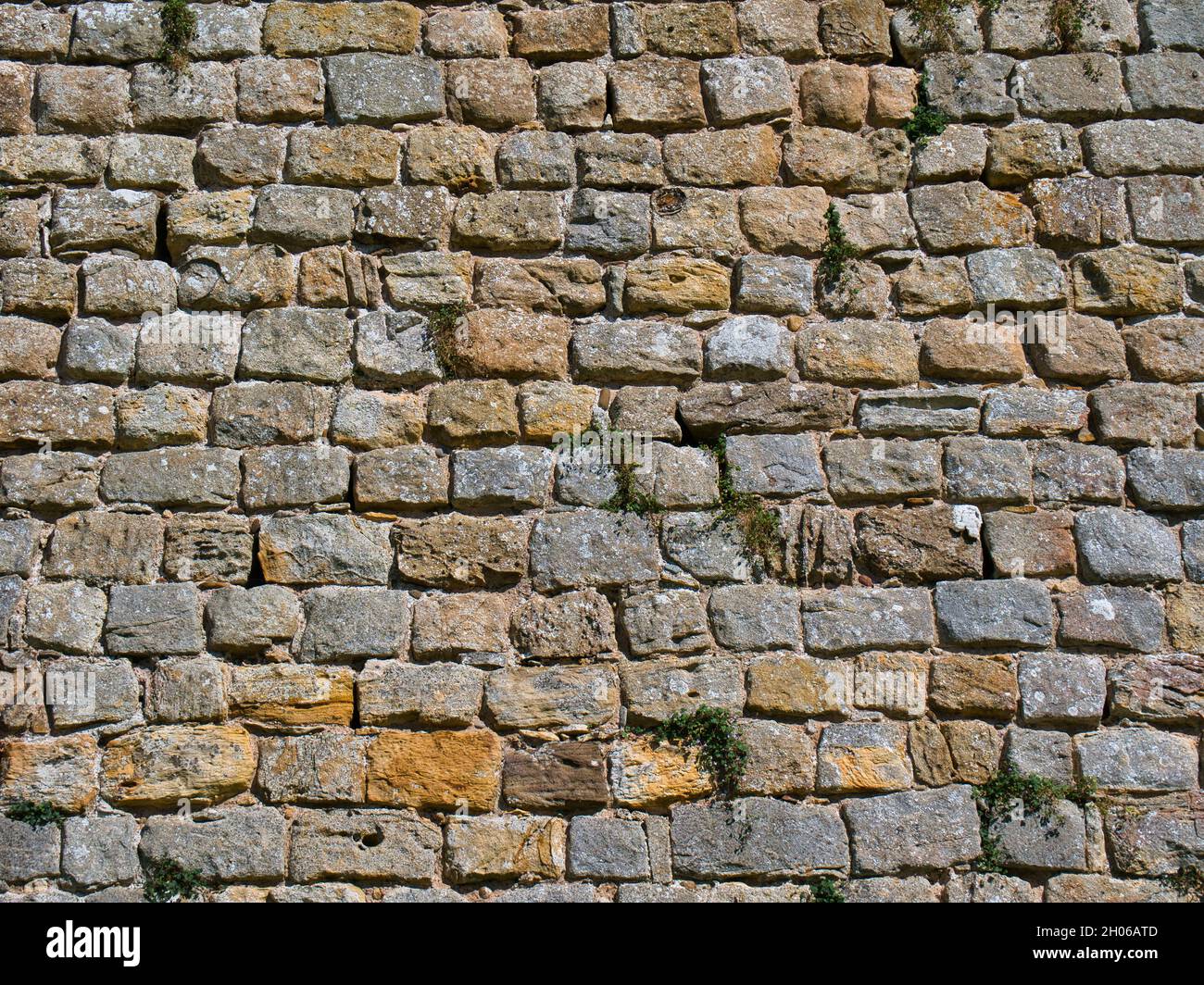 Rows of old stone blocks in an ancient wall. Taken on a sunny day Stock  Photo - Alamy