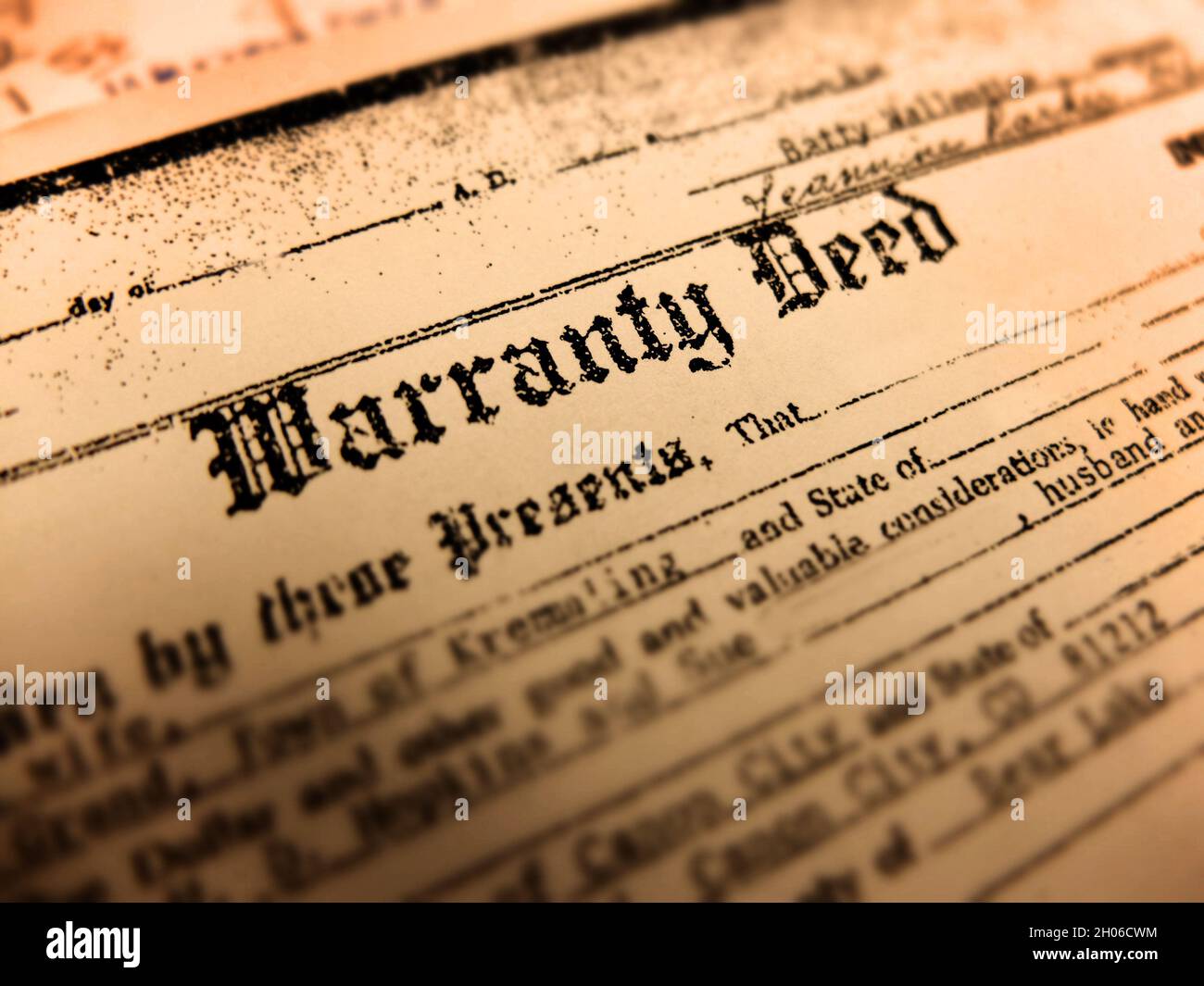 Old warranty deed transfer title to land real property home legal document Stock Photo