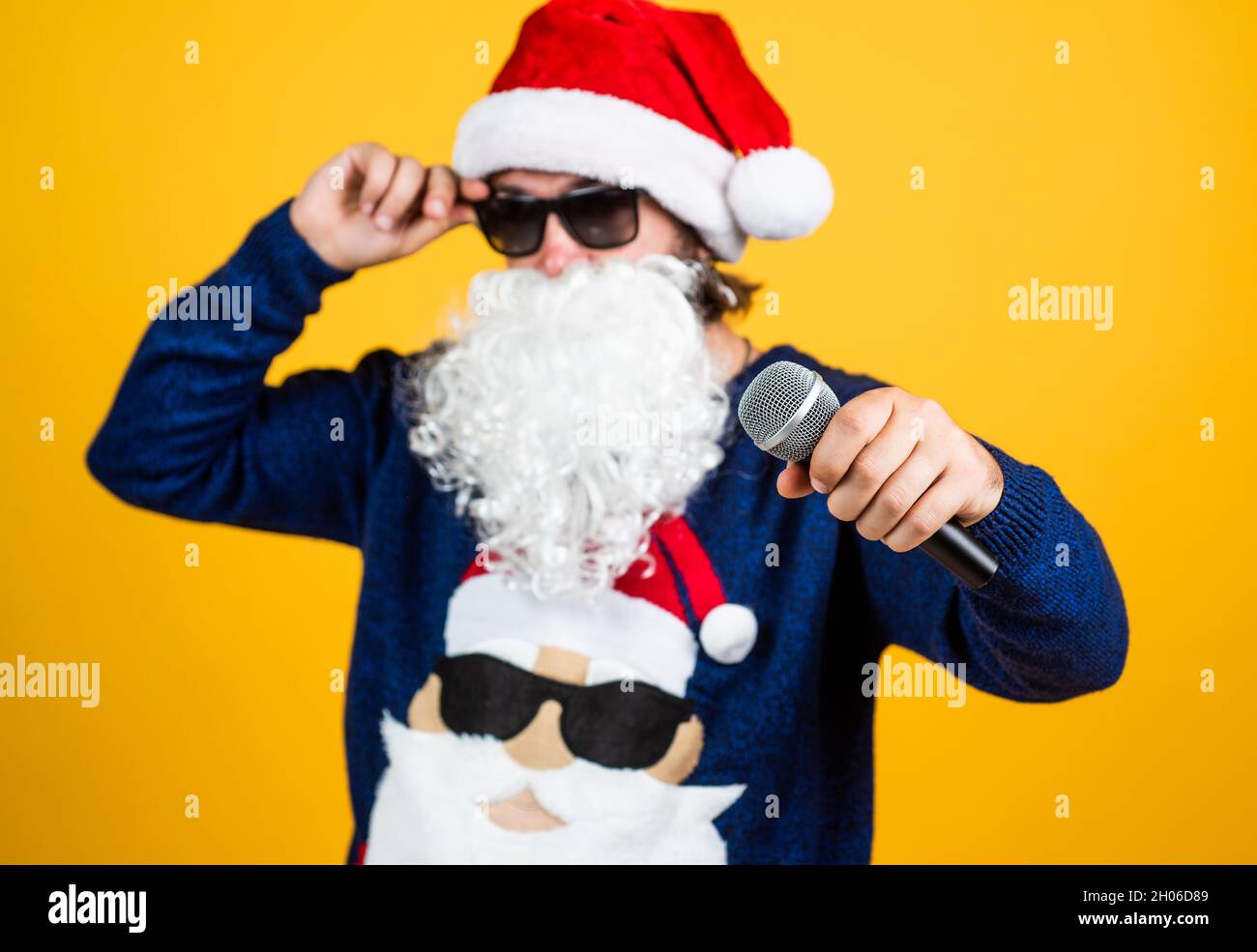 Congratulating his nearest. christmas songs. xmas shopping time. prepare  gifts and presents. karaoke. happy bearded man in santa hat sing in Stock  Photo - Alamy