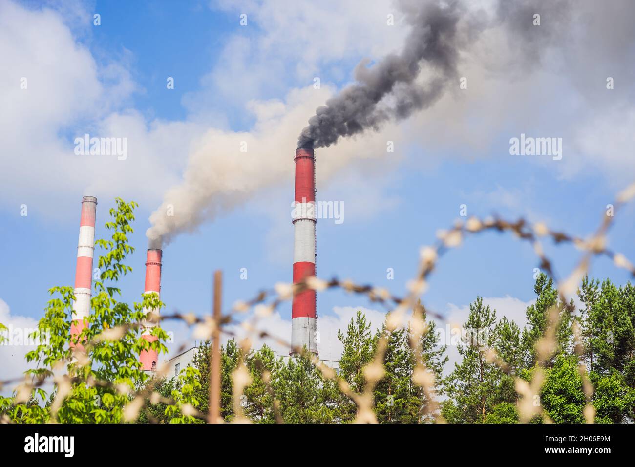 plant pipe with smoke against blue sky Stock Photo - Alamy