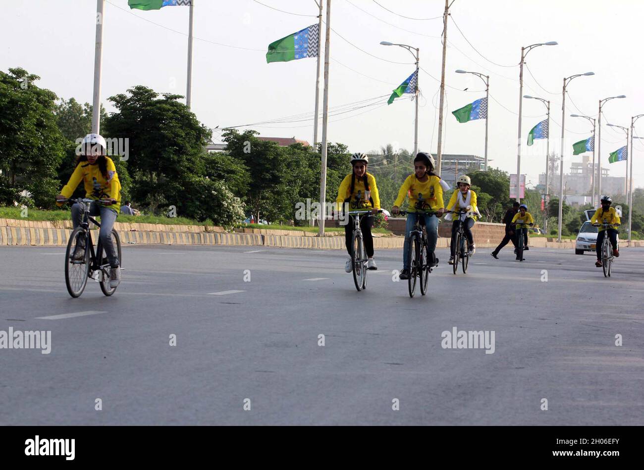 Participants are holding cycle race to mark the International Day of the Girl Child 2021 organized by Lyari Girls Cafe held in Karachi on Monday, October 11, 2021. Stock Photo