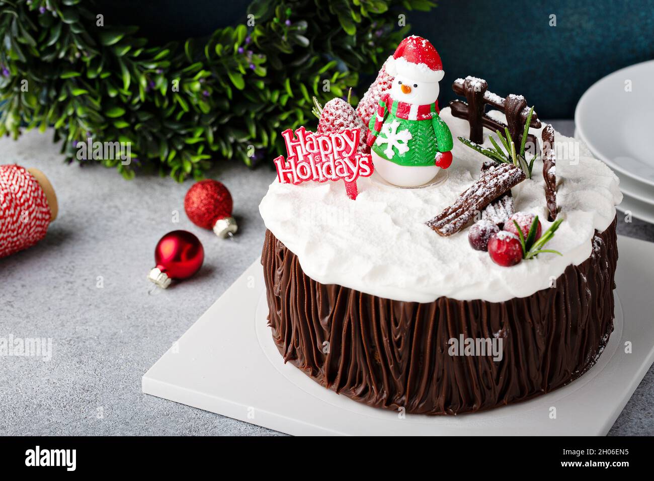 Chocolate Christmas celebration cake with holiday decorations Stock