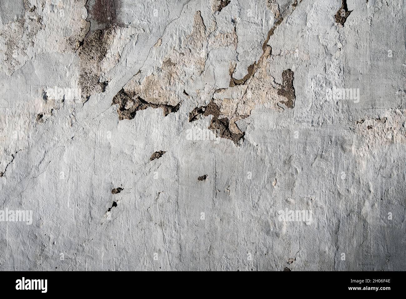 Old plastered brick wall, aged and weathered, abstract texture background Stock Photo