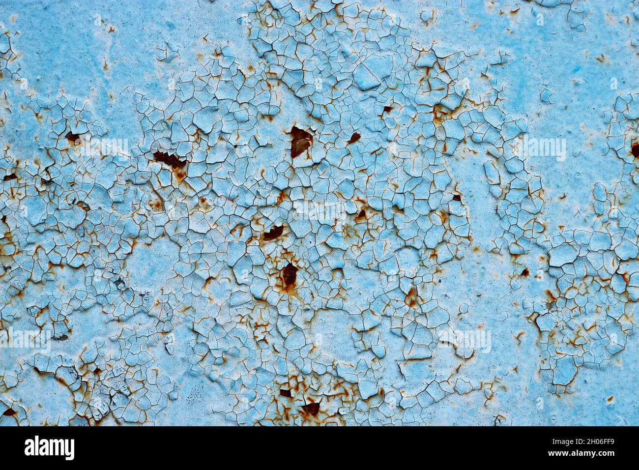 Cracked paint and rusty metal background. Stock Photo