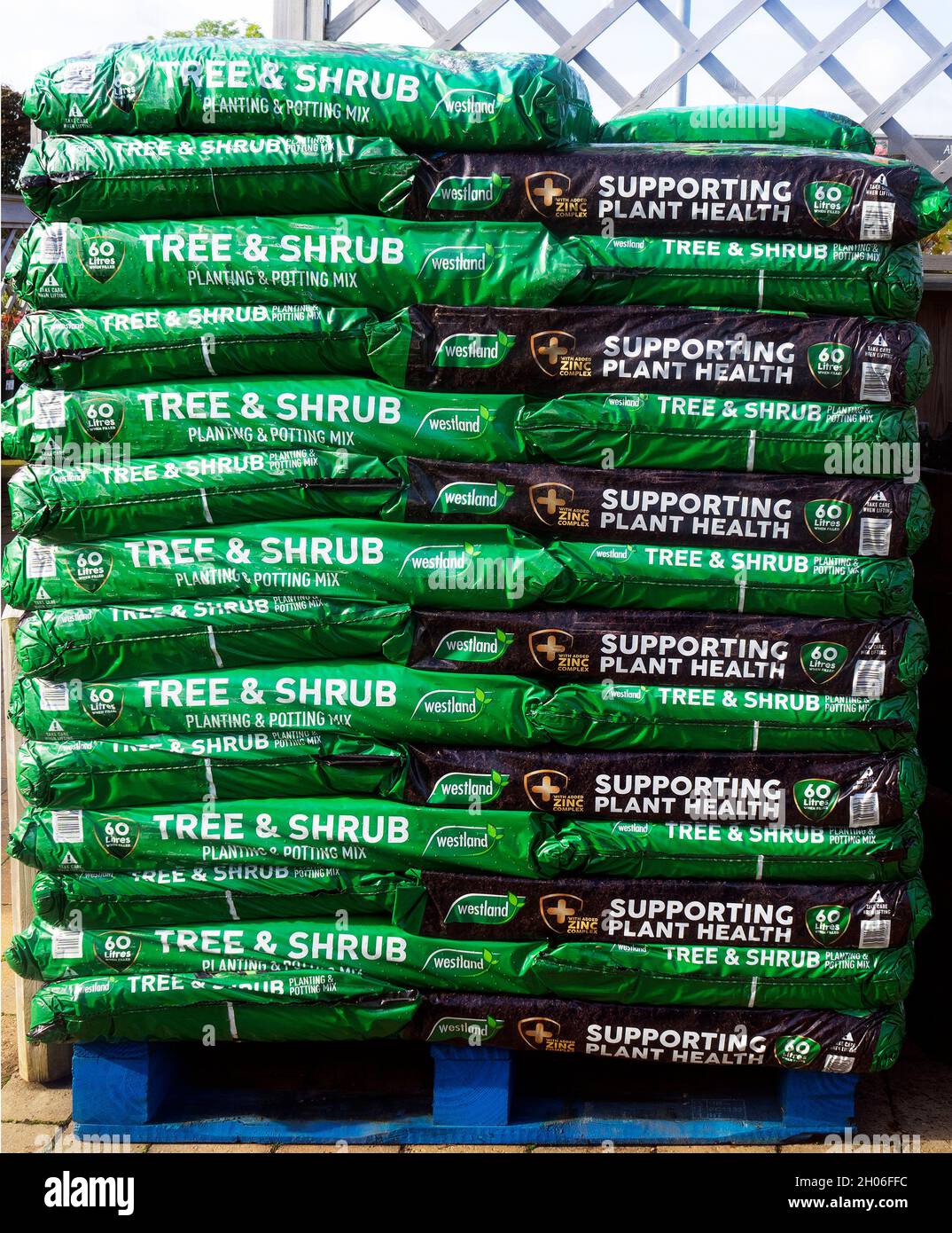 A stack of bags of Westland Tree and Shrub Planting in a garden centre
