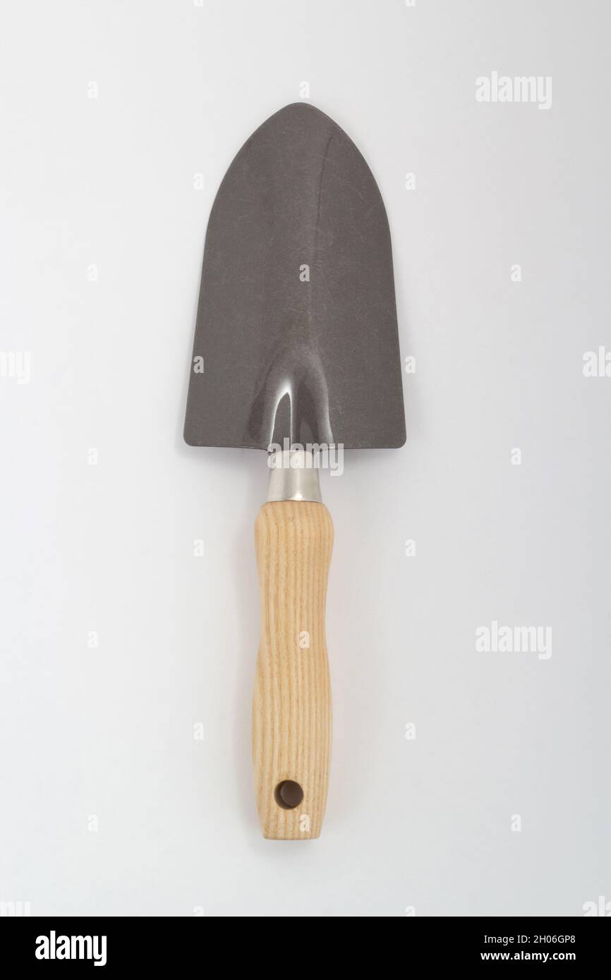 Small shovel with wooden handle, gardening tool isolated on white