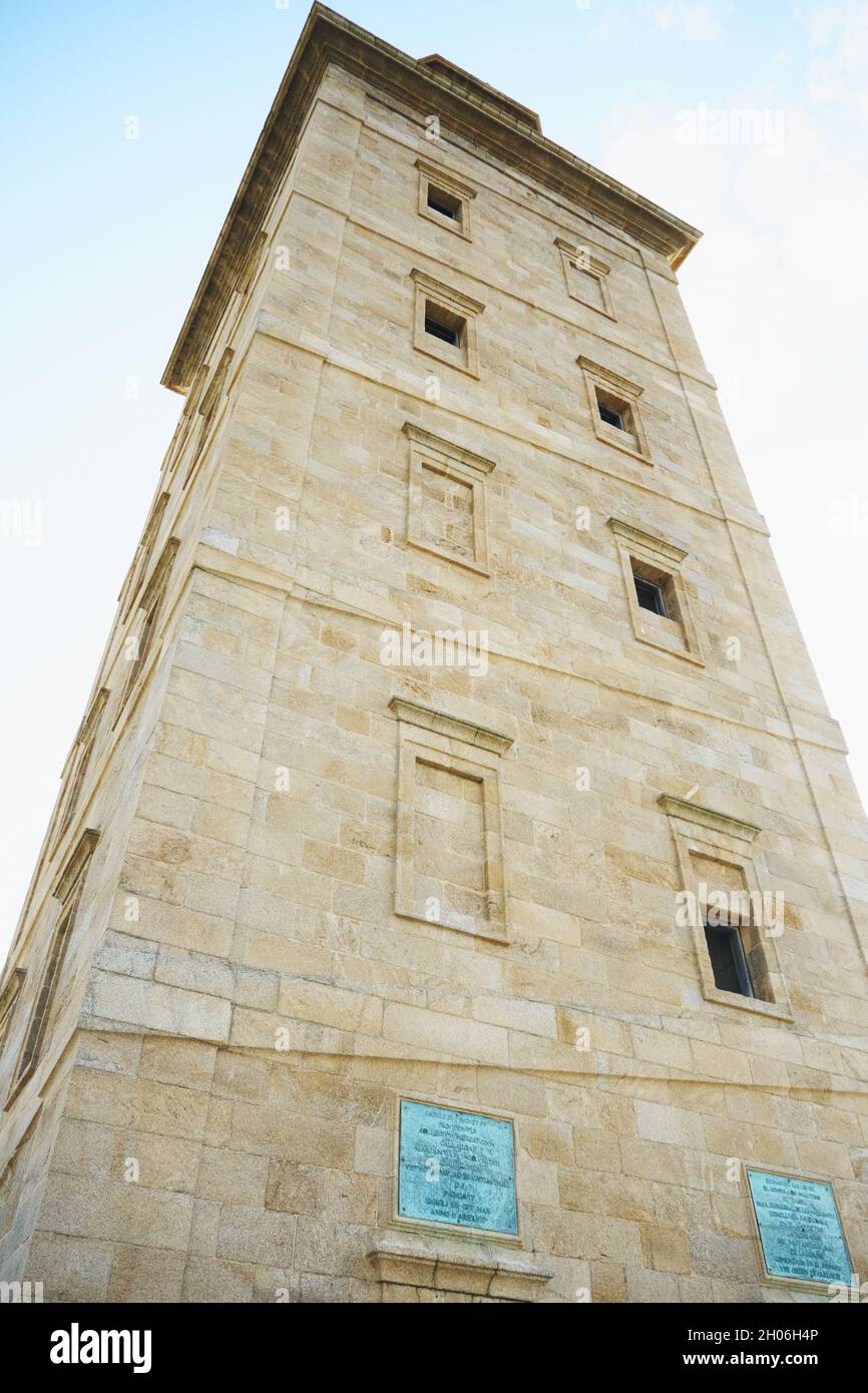 Vertical low angle shot of the Tower of Hercules in A Coruna, Galicia, Spain Stock Photo